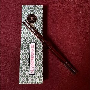 Set of 18 wood chopsticks in box.